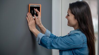 A girl installing Burglar Alarms