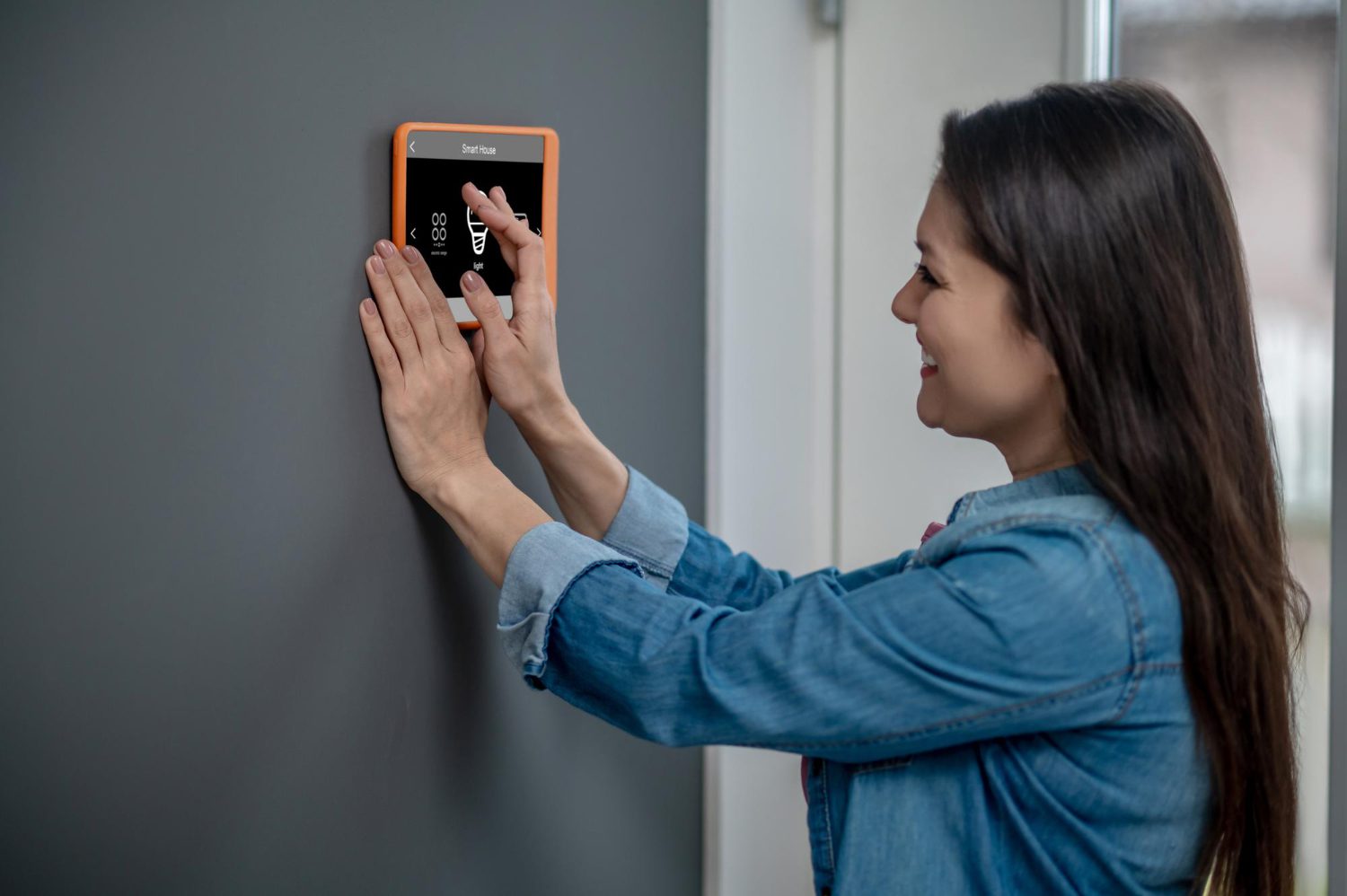 A girl installing Burglar Alarms