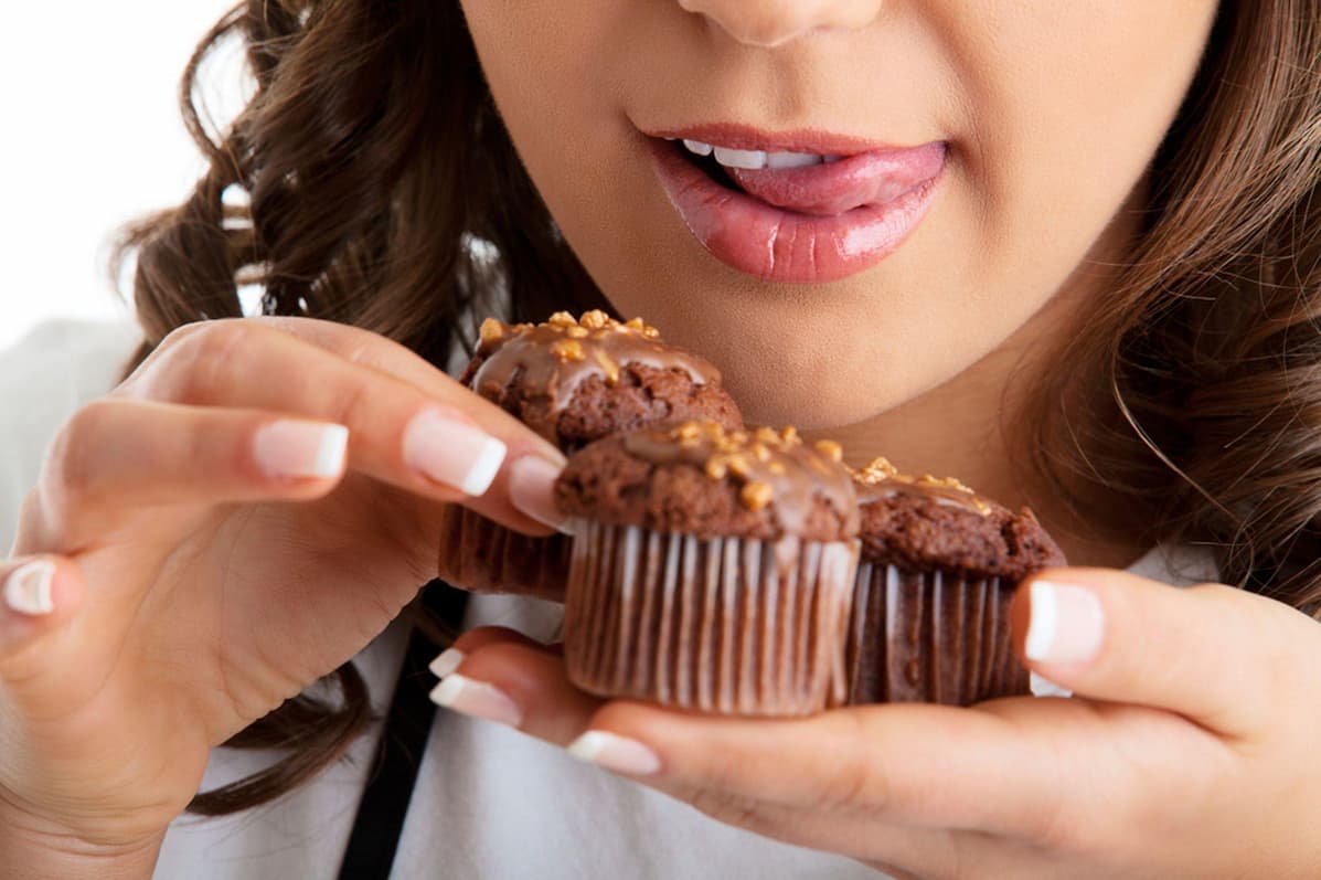 A girl eating Christmas Desserts