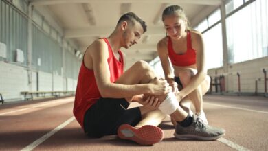 Health Dilemmas ,Woman Wrapping Man's Leg with Bandage