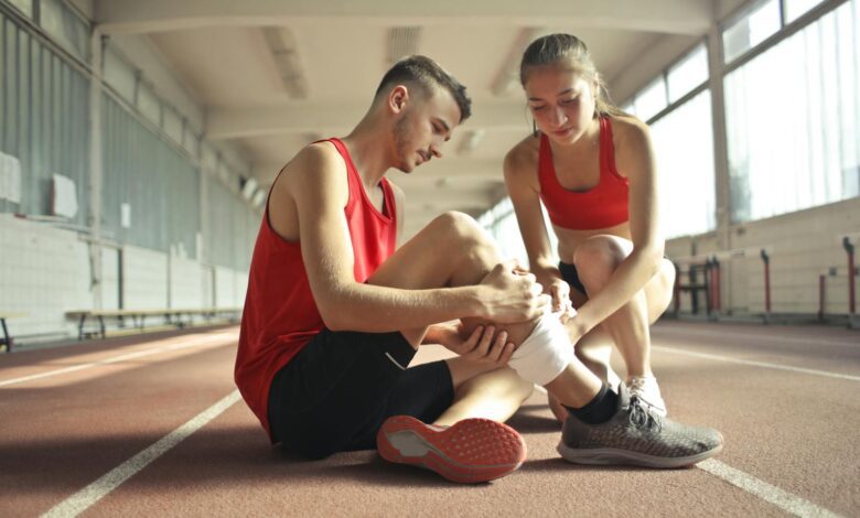 Health Dilemmas ,Woman Wrapping Man's Leg with Bandage