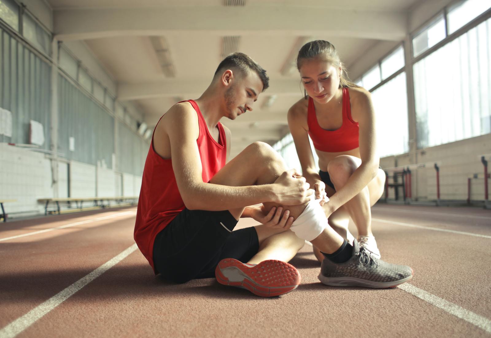 Health Dilemmas ,Woman Wrapping Man's Leg with Bandage